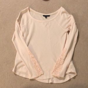 Light pink top with lacy sleeves